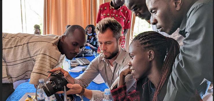 Patricia (right, center) and her group receiving instructions on shooting a documenrary style interview from a Rana Labs trainer. 