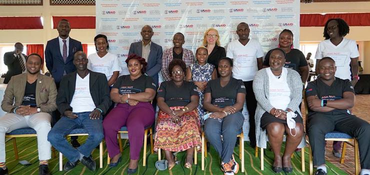 Kuraish (center) poses for a group photo with other GUIDE participants during the launch of the program in January 2022