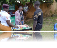 As part of the GUIDE program, Kurdish (center) used board games to gather young boys and men together to involve them in the fight against HIV