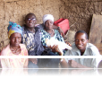 PFL Director, Reverend Kollie (left) reunites former detainee (far right) with his family