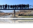 Before the bridge was built, makeshift wood planks and stones were used to help students cross.