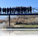 Before the bridge was built, makeshift wood planks and stones were used to help students cross.