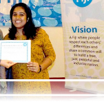 Alzima Bano, one of the mediators at the training on dialogue facilitation, receives her certificate from Lead Facilitator Sylvia McMechan.