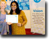 Alzima Bano, one of the mediators at the training on dialogue facilitation, receives her certificate from Lead Facilitator Sylvia McMechan.